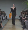 Model Brogan Loftus walks the Celine Fall/Winter 2014 womenswear show in Paris. Video via WWD
